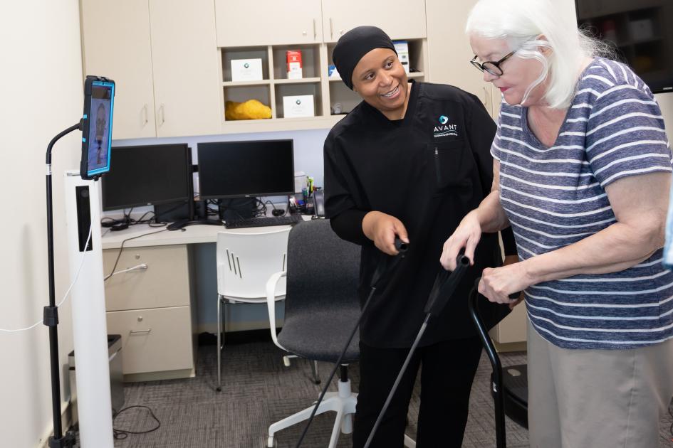 Amina AbubakarAmina Abubakar, PharmD, and owner of Avant Pharmacy & Wellness Center in Charlotte, NC, helps a patient with mobility exercises.