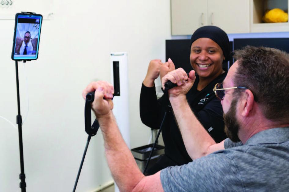 Pharmacist coaches patient along with physiatrist telehealth visit,